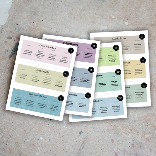 Mantra cards on pastel sheets featuring themes like mindfulness, gratitude, and self-care, arranged on a stone-textured background.