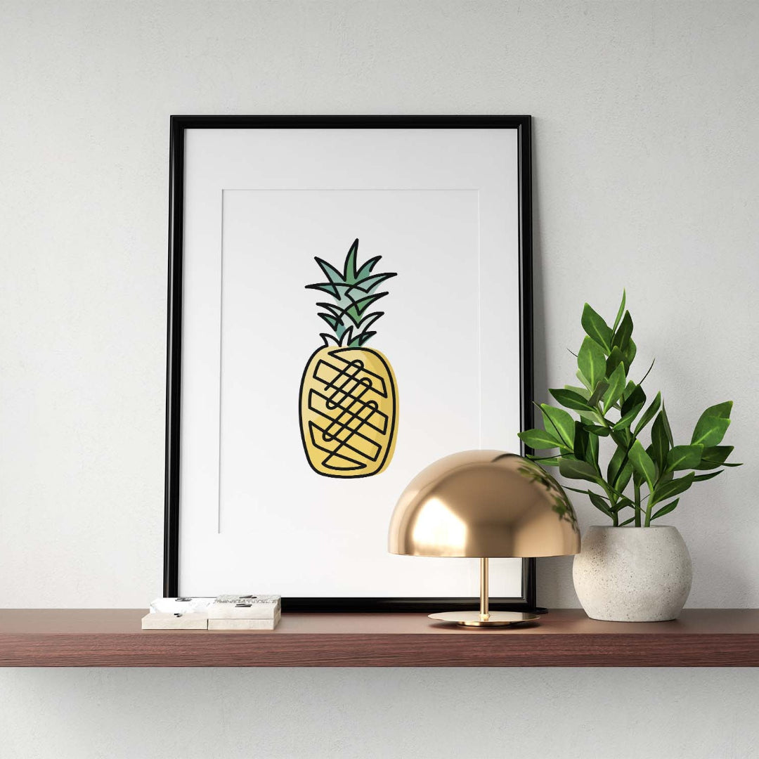 Black single-line art of pineapple on white, framed in black, with metal lamp and potted plant on wooden shelf.